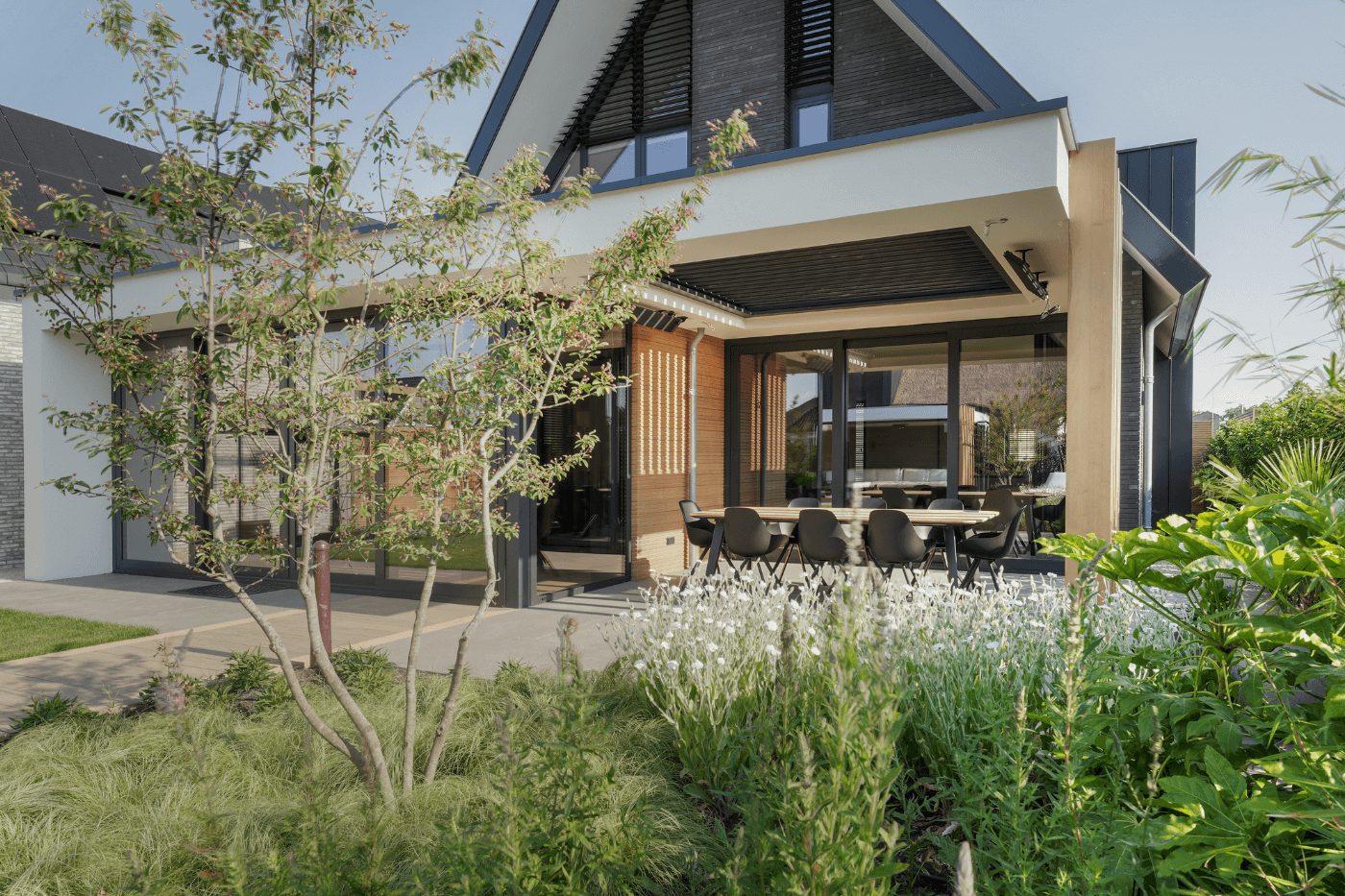 Ibizatuin veranda terrasheaters eettafel buiten tuinarchitect